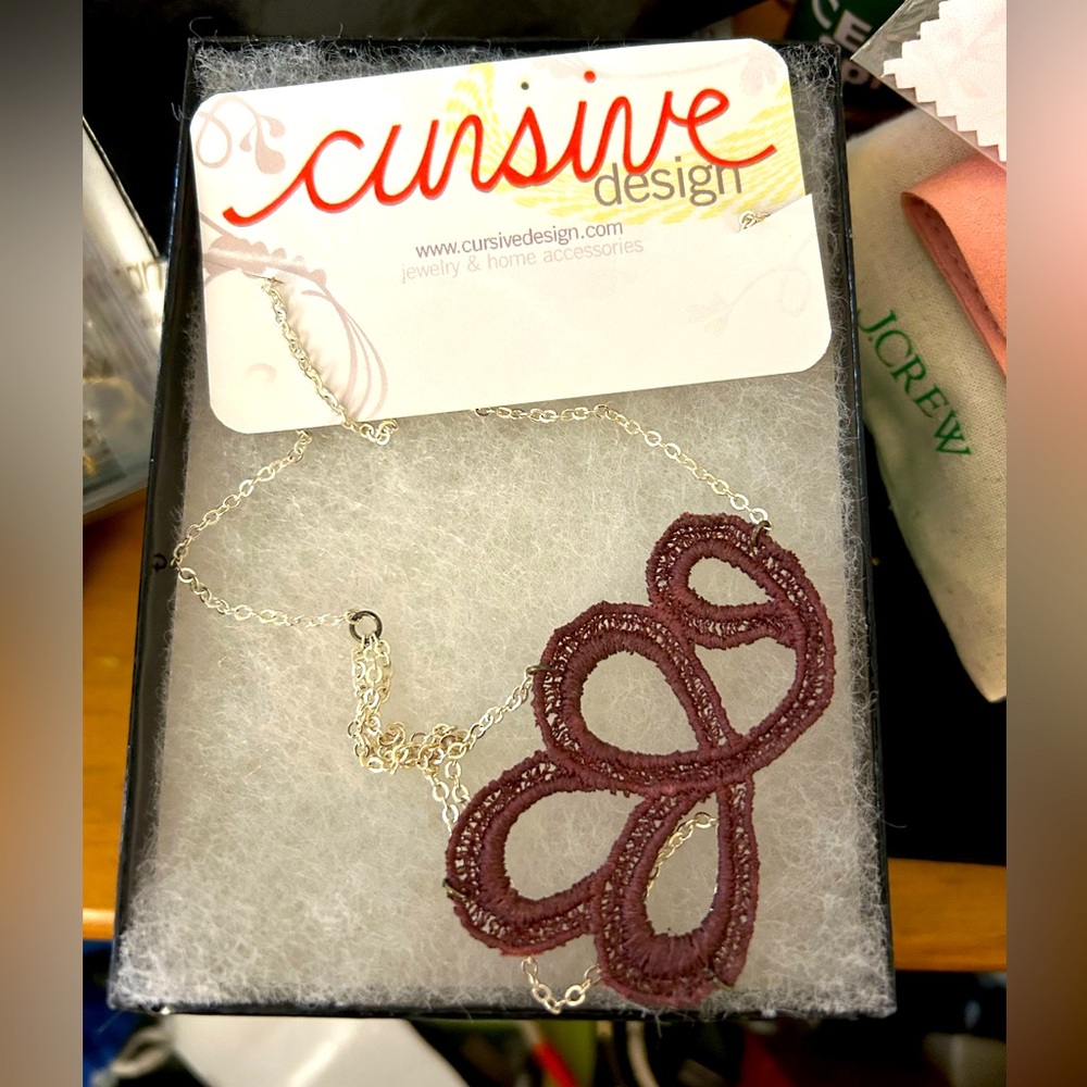 New Silver chain necklace with purple embroidered segment from Cursive Design.